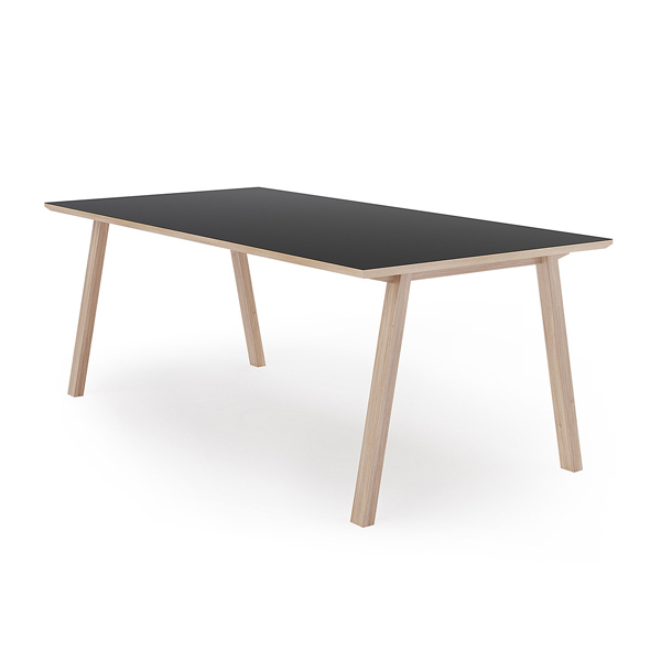 Billede af Moderne spisebord eller langbord med plads til 6 pers. + to ved bordenderne. Pladen i MDF med synlig kant, og overflade af sort linoleum.